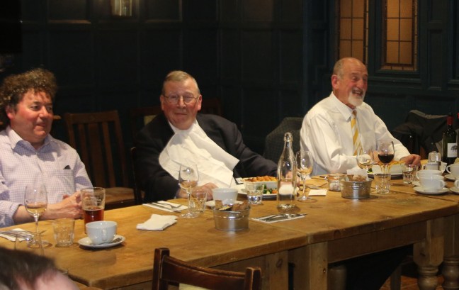 Liam, William and Noel enjoying conversation over dinner