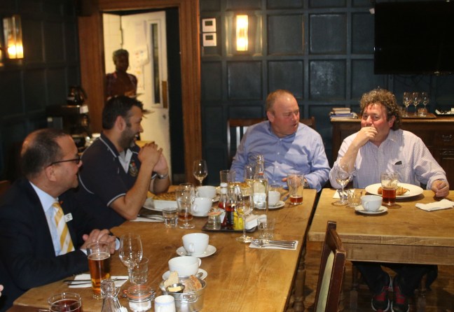 Brendan shares an aside with Liam, while Patrick and Matt join in