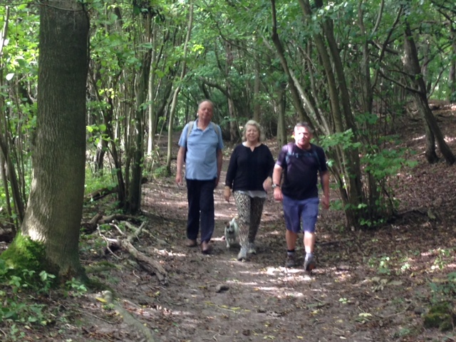 three people in the woods